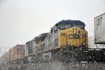 Stack train races east through the snow